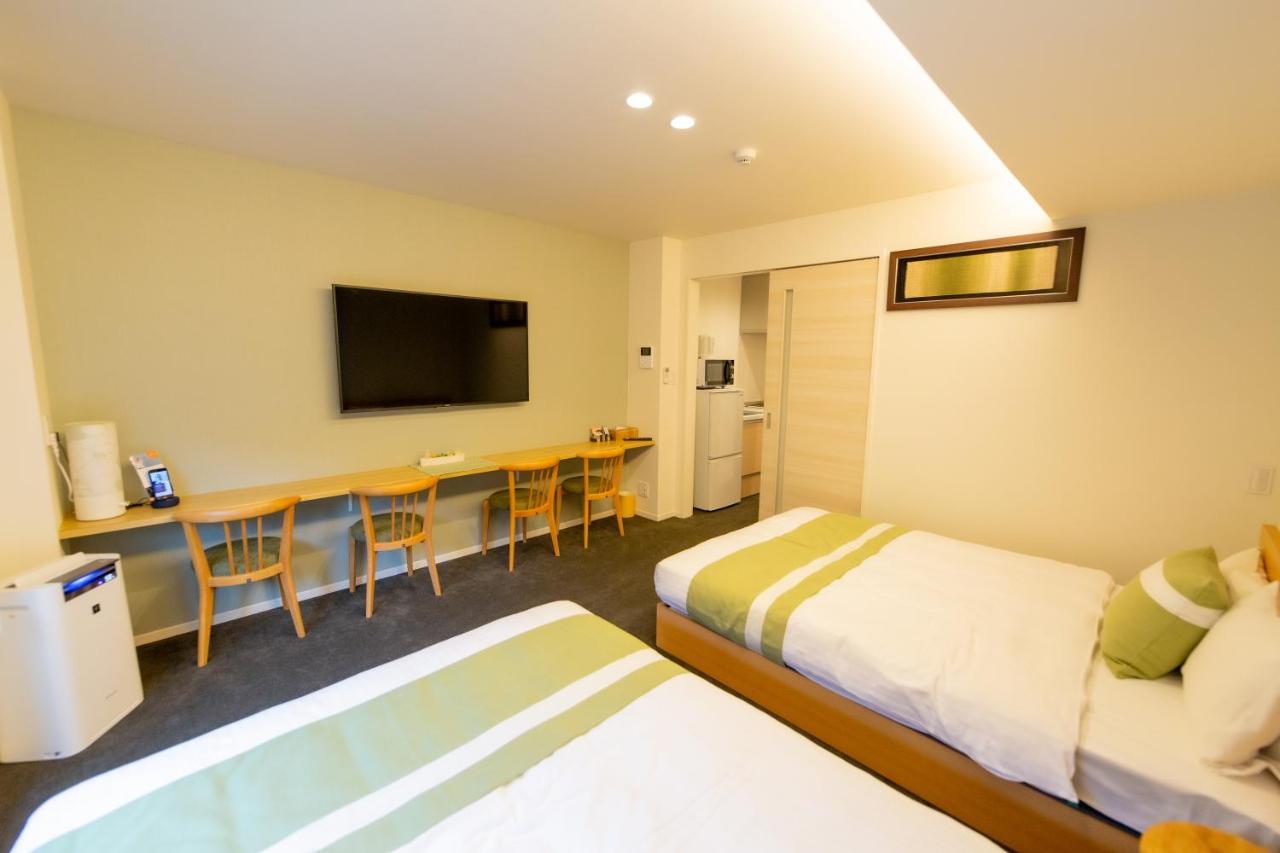 Апарт отель Grand Base Hiroshima Ekimae Экстерьер фото